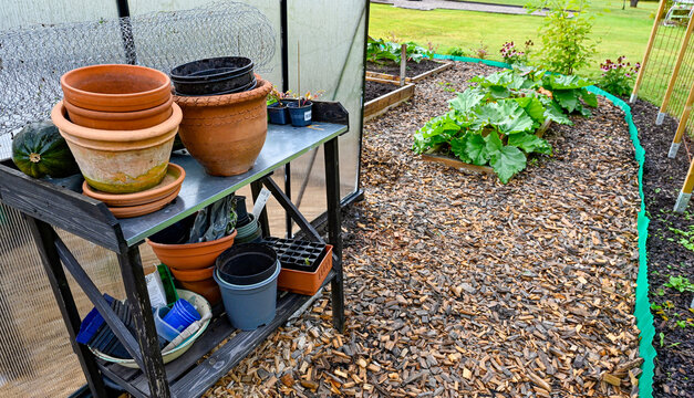 greenhouse and gardening table in cultivating area