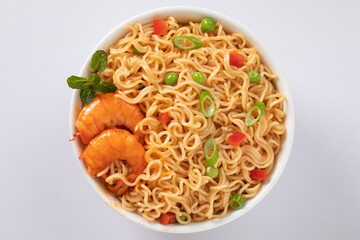 Bowl of noodles on white background