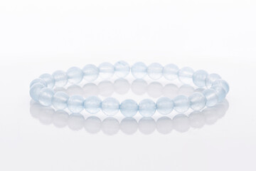 Blue jadeite gemstone bracelet isolated on white background. Natural stone jewelry.
