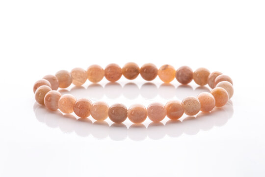 Beige Sunstone gemstone bracelet isolated on white background. Natural stone jewelry.