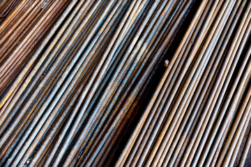Obraz premium Round steel bars on pile in the warehouse