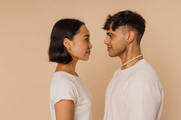 Young beautiful asian calm woman and stylish calm man