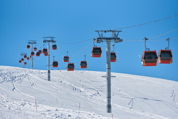 Ski lift in the snowy mountains of Arkhyz resort city in Russia