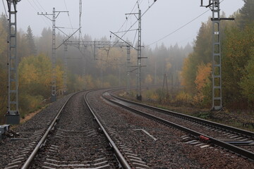 foggy railway in the bend