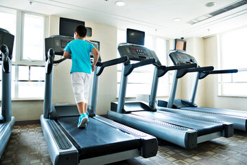 Little boy running on the treadmill