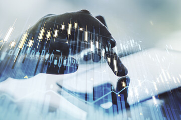 Multi exposure of abstract creative financial graph with finger presses on a digital tablet on background, forex and investment concept
