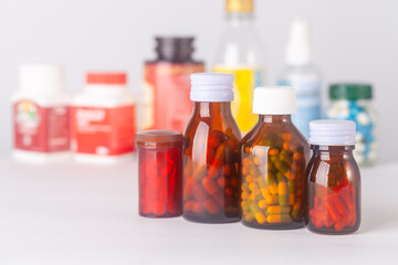 group of medicine bottle and pills
