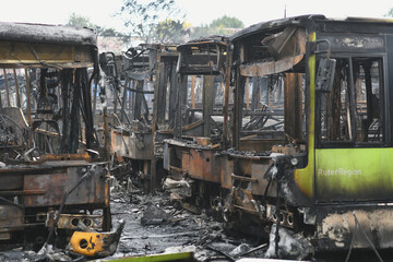 Fototapeta premium Burnt buses after a missile attack on the city of Dnipro, Ukraine.