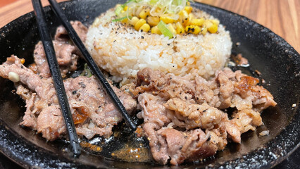 selective focus grilled beef steak with korean sauce bulgogi on top of rice with slice of pepper...