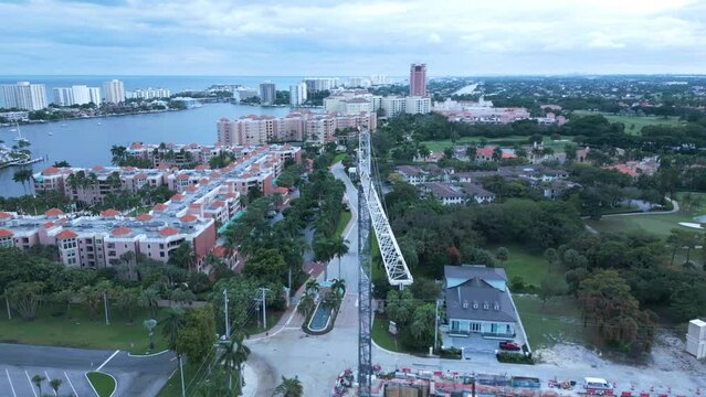 Boca Raton FL USA, Aerial View Of Construction Site And Cranes By Lake And Upscale Resort, Drone Shot