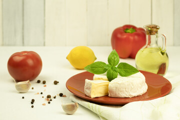 Delicious Camembert cheese, on a light background