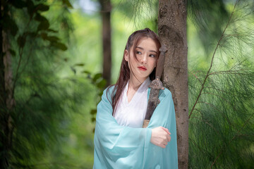 Young beautiful Asian woman wear dressing in traditional Chinese costume ancient fashion style...