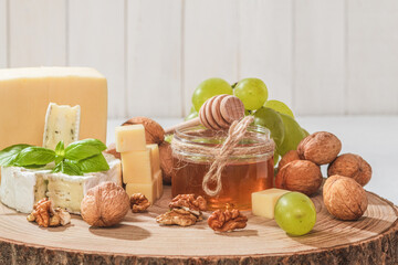 Obraz na płótnie Canvas Nuts and a jar of honey, close-up