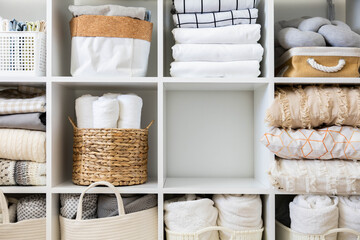 Bed linens closet neatly arrangement on shelves with copy space domestic textile Nordic minimalism