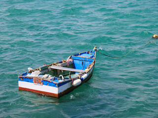 Fototapeta na wymiar Colourful old fishing boat on the sea