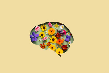 Paper cut brain and flowers on yellow background. Mental health concept