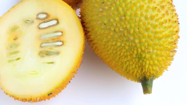 Gac fruits, Sweet Grourd or Cochinchin Gourd isolated on a white background. selective focus. Rotating on white background. Top view