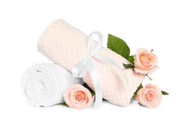 clean soft towels with flowers isolated on white