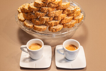 A couple of cups of Italian espresso coffee and traditional Cantucci cookies