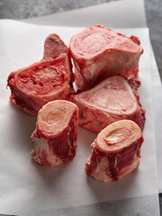 Beef Bones for Making Broth on white paper. Raw beef bones for soup