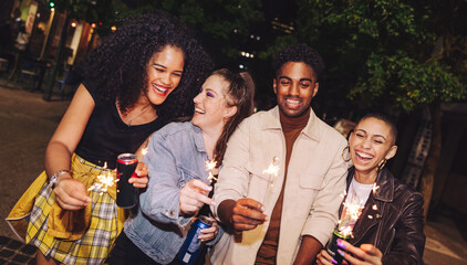 City friends celebrating the festive season with sparklers