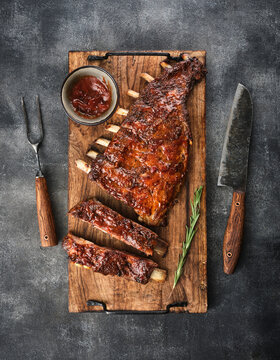 Delicious smoked pork ribs glazed in BBQ sauce.