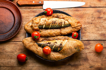 Whole mackerel roasted in dough