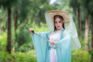 Young beautiful Asian woman wear dressing in traditional Chinese costume ancient fashion style...