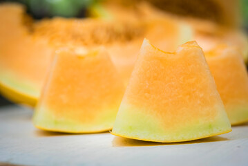 sliced of melons, fresh Melon or cantaloupe, Cantaloupe melons on wood background, Favorite fruit in summer