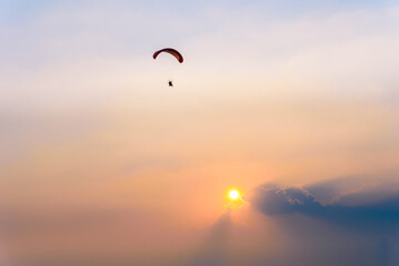 Paramotor flying on the sky, Paramotor flying on the sky ,adventure man active extreme sport pilot flying in sky with paramotor
