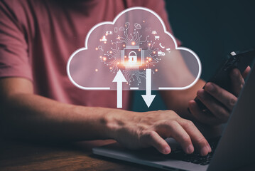 Businessman using computer with Big data analytics and business intelligence Cloud computing management concept with chart and graph icons on a digital clouds technology interface.