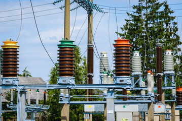 High voltage power transformer substation.High voltage electric power transformers in the blue...