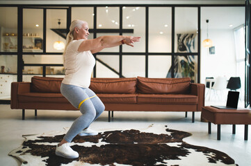 Joyous lady performing a lower body exercise