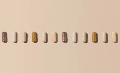 Foto auf Acrylglas Mix of medical capsules in a line on light beige top view, hard shadows. Dietary supplements © katrinshine