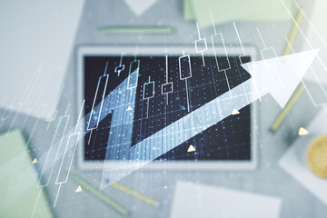 Double exposure of abstract creative financial diagram with upward arrow and modern digital tablet on background, growth and development concept