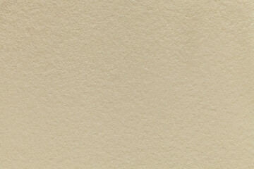 Fototapeta premium Texture of vintage light beige colors paper background, macro. Structure of dense brown craft cardboard.