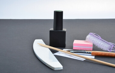 Manicure set. Gel polish. Grey background.