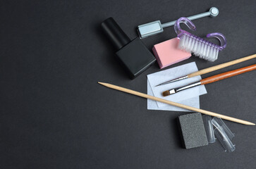 Manicure set close-up. Black background
