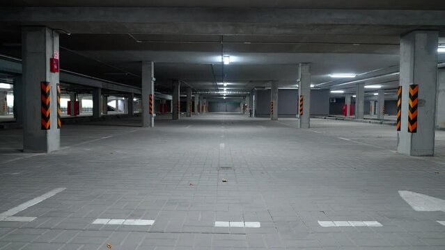 Static background of underground parking, the parking of an office building with concrete walls, concrete tunnel, template for chromakey.