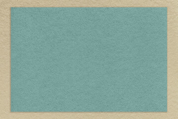 Texture of old craft blue color paper background with beige border. Vintage kraft cerulean and brown cardboard