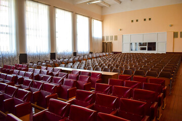 Assembly hall in the cultural center with red seats for spectators