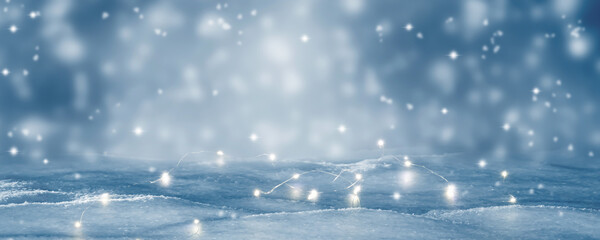 abstract winter landscape with christmas lights on blue blurred background, beautiful greeting card...