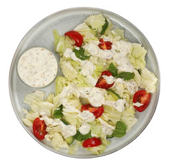 Delicious salad with Chinese cabbage, tomatoes, cucumber and dressing isolated on white, top view