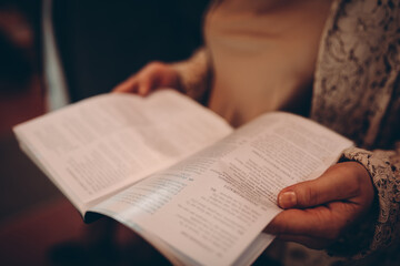Naklejka premium person reading a book