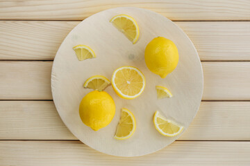 Sliced lemon on a white wooden board