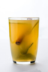 Christmas or New Year hot winter drink, spicy grog cocktail, punch or mulled wine with tea, lemon, cinnamon.