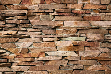 stock photo of rough stone wall with decorative structure