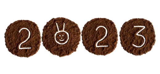 New year 2023 from coffee drawn on a white background from ground coffee, year of the rabbit