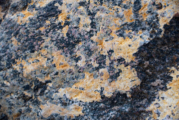 Textured surface of colorful stone