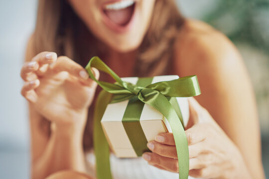 Sexy Brunette Woman On Bad Having Gift Box